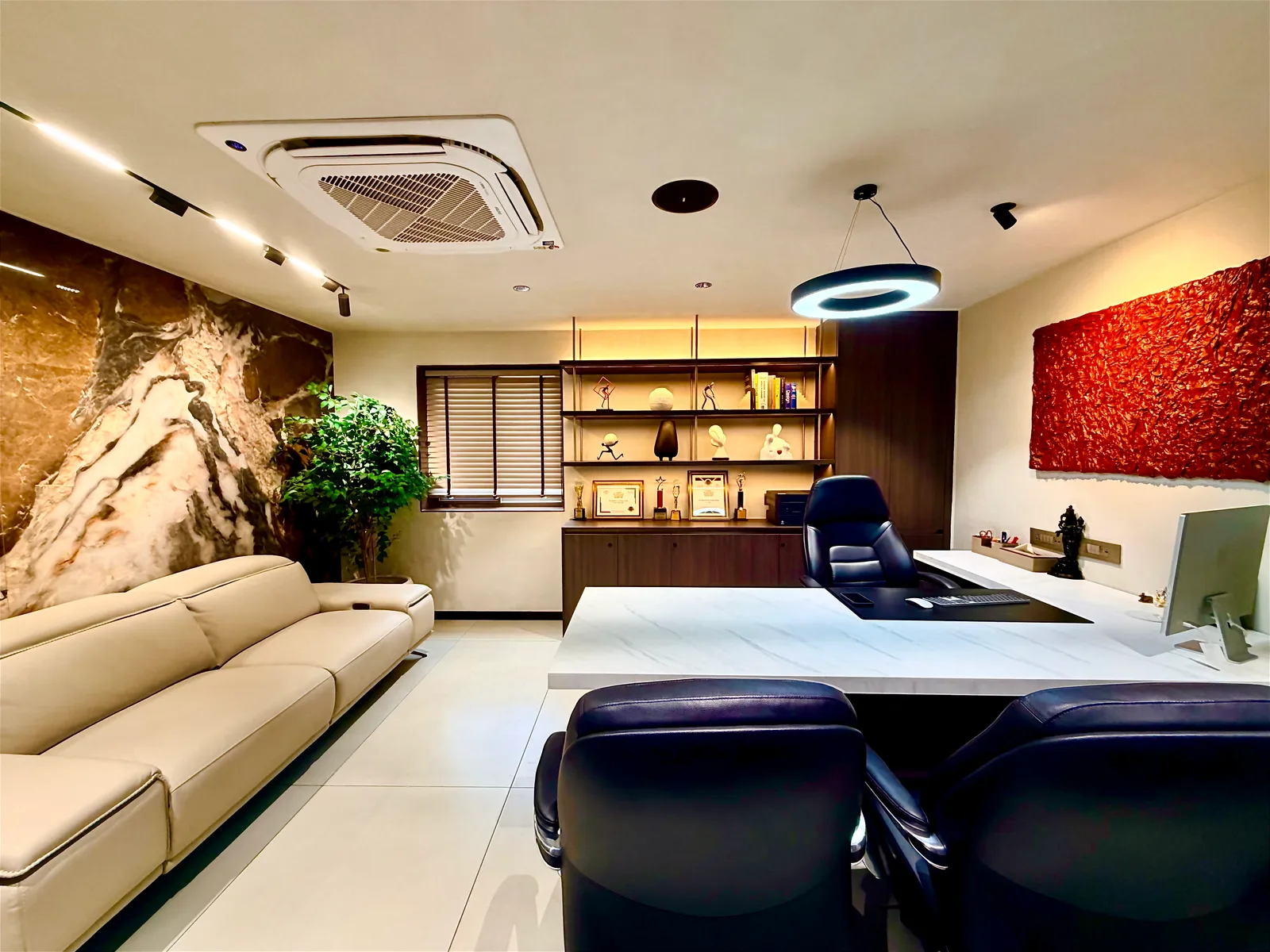 The finished La'espace director's cabin, with its book-matched marble feature wall and walnut joinery
